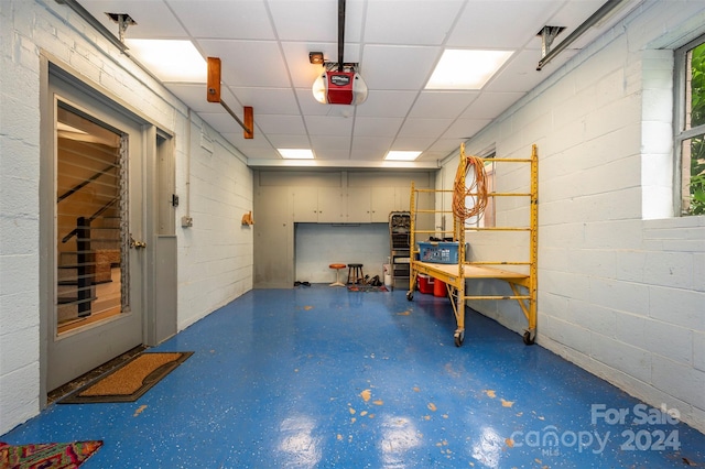 basement featuring a drop ceiling