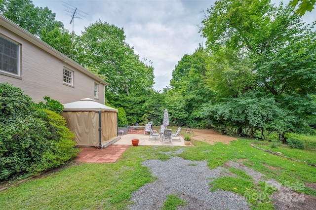 view of yard with a gazebo and a patio