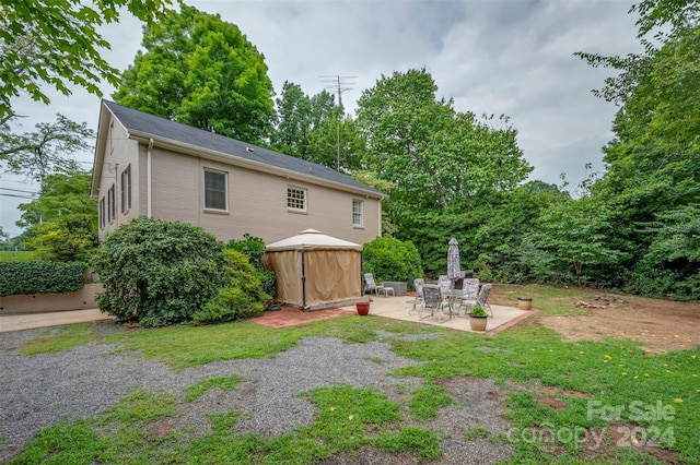 view of yard featuring a gazebo and a patio