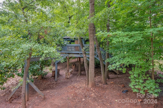 view of yard featuring a wooden deck