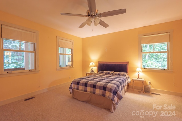 carpeted bedroom with ceiling fan