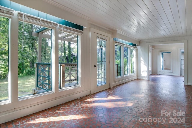 doorway to outside featuring wooden ceiling