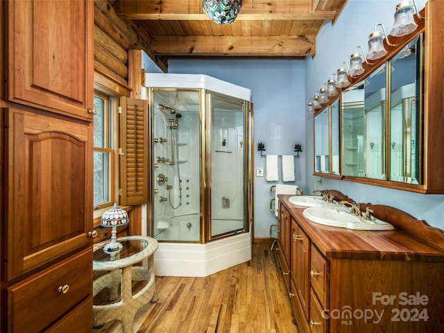 bathroom with wooden ceiling, beamed ceiling, hardwood / wood-style floors, an enclosed shower, and vanity