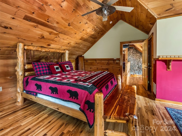 bedroom featuring ceiling fan, hardwood / wood-style floors, wooden ceiling, and vaulted ceiling