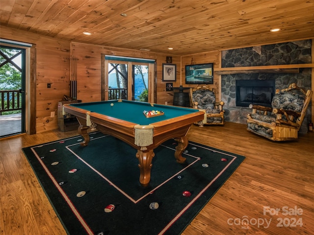 playroom with wood walls, wood-type flooring, a wealth of natural light, and wooden ceiling