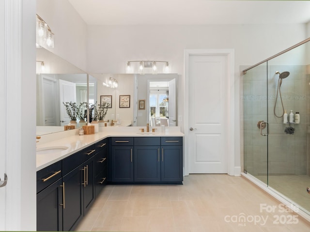 bathroom featuring vanity, tile patterned flooring, and a shower with door