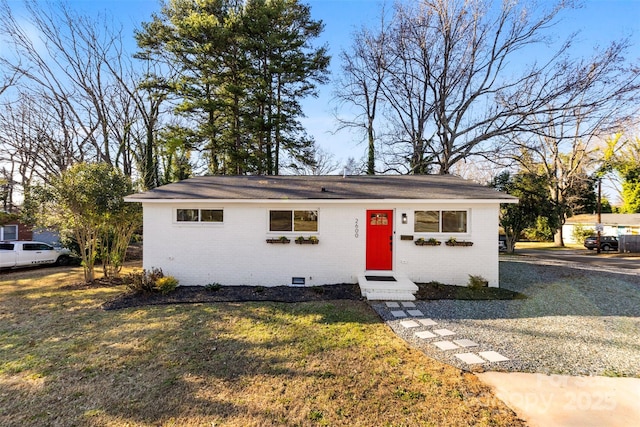 ranch-style home with a front lawn