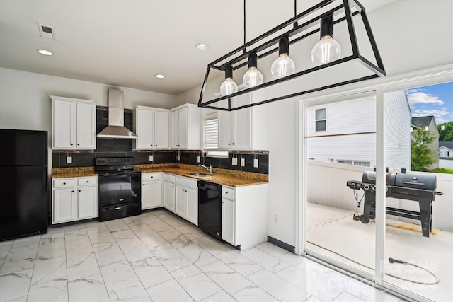 kitchen with black appliances, white cabinets, sink, backsplash, and wall chimney exhaust hood