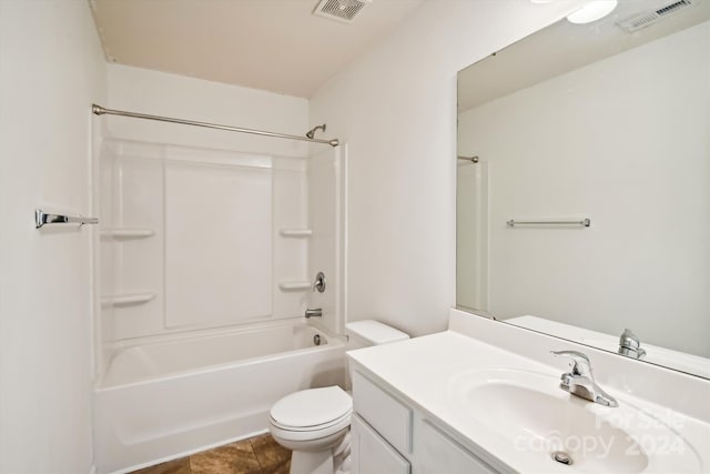 full bathroom with tile patterned flooring, shower / bath combination, toilet, and vanity