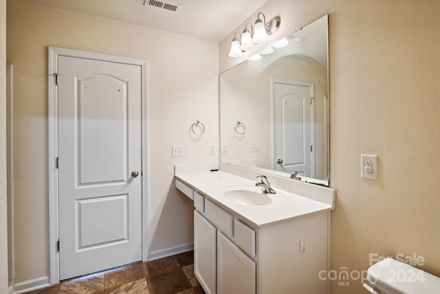 bathroom with tile patterned floors, toilet, and vanity