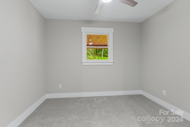 spare room with ceiling fan and carpet flooring