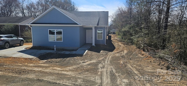 view of front of home featuring concrete driveway