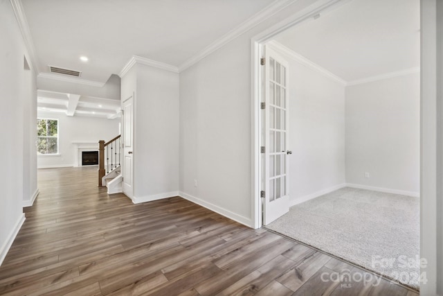 hall with dark hardwood / wood-style flooring, beam ceiling, and crown molding