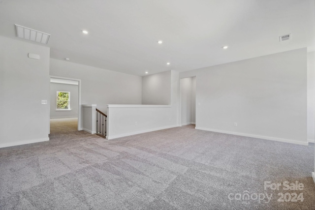 empty room with light colored carpet