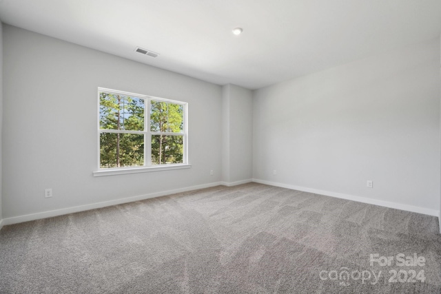 empty room with carpet flooring