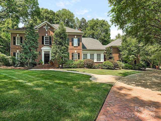 view of front of home with a front yard