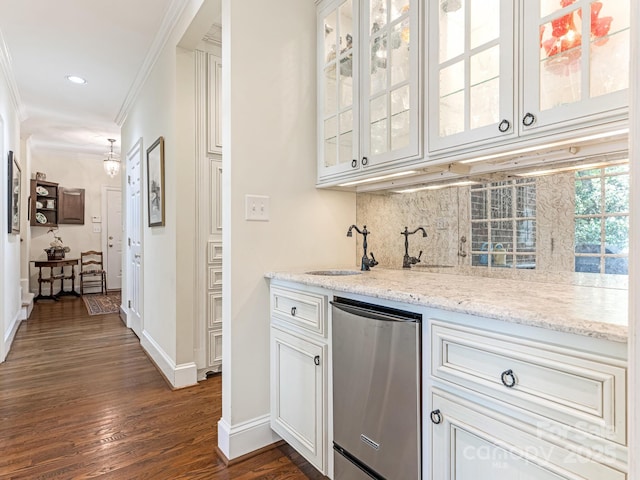 bar featuring sink, white cabinetry, light stone countertops, ornamental molding, and dark hardwood / wood-style flooring