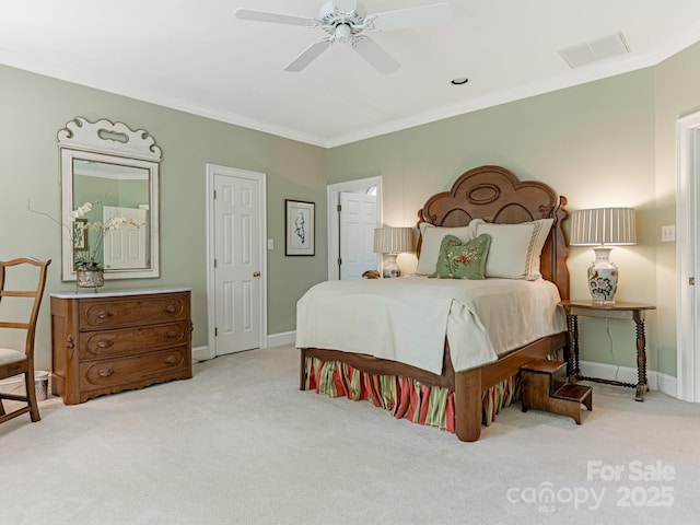 carpeted bedroom with ceiling fan and crown molding