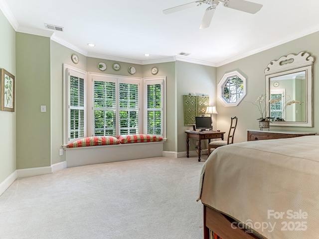 bedroom featuring ceiling fan, light colored carpet, multiple windows, and crown molding