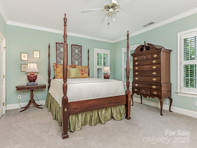 carpeted bedroom featuring ceiling fan, multiple windows, and crown molding