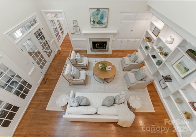 4301 Fairview Oaks Dr, Charlotte, NC 28211 - living room with wood finished floors and a fireplace with flush hearth