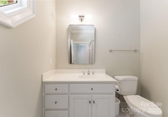 4301 Fairview Oaks Dr, Charlotte, NC 28211 - bathroom featuring toilet, vanity, and a skylight