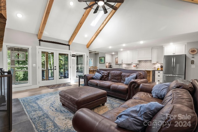 living room featuring ceiling fan, high vaulted ceiling, hardwood / wood-style floors, beam ceiling, and french doors