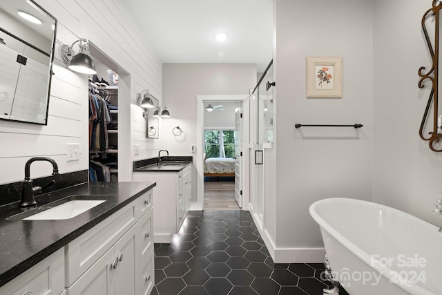 bathroom with shower with separate bathtub, vanity, and wood-type flooring