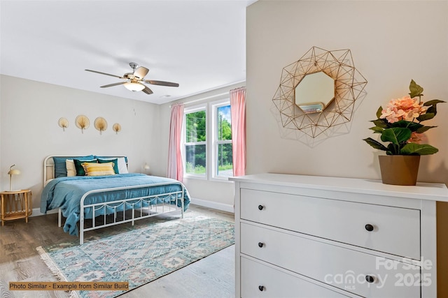 bedroom with hardwood / wood-style floors and ceiling fan