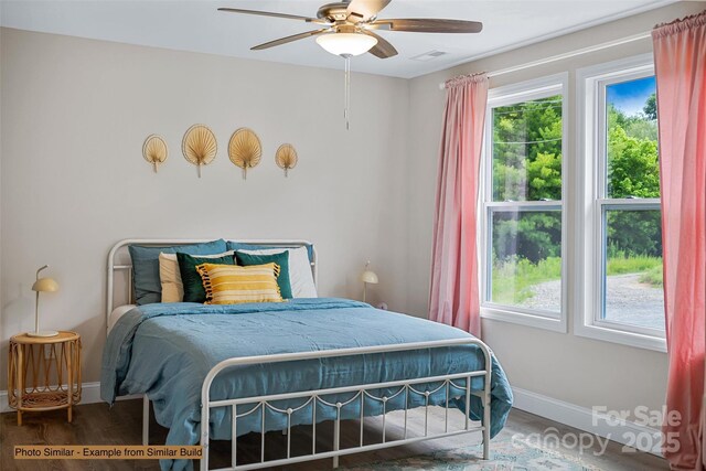 bedroom with ceiling fan and hardwood / wood-style flooring