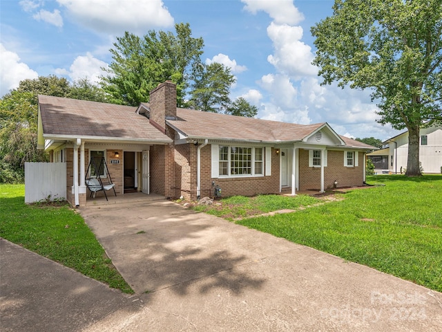 ranch-style home with a front lawn