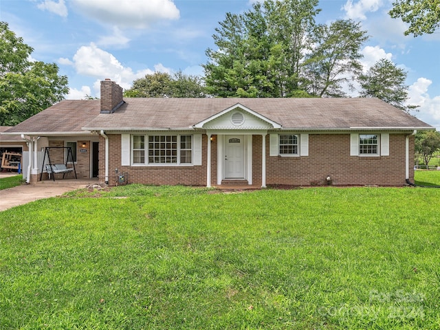 ranch-style house with a front yard