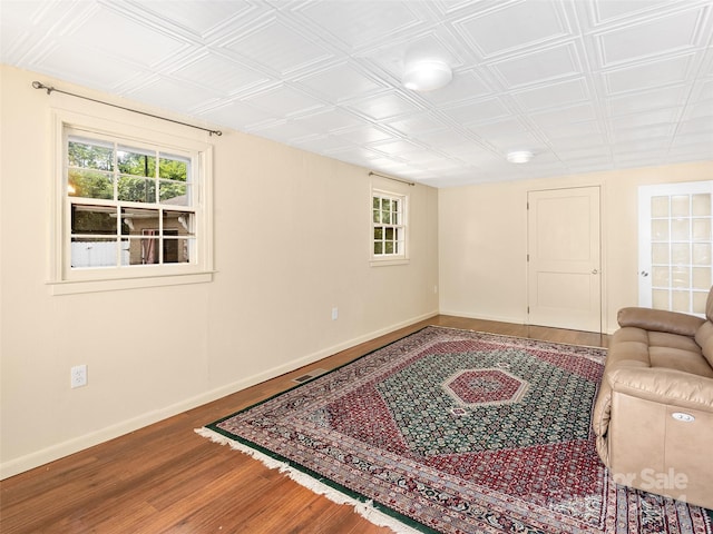 living room featuring a wealth of natural light and wood-type flooring