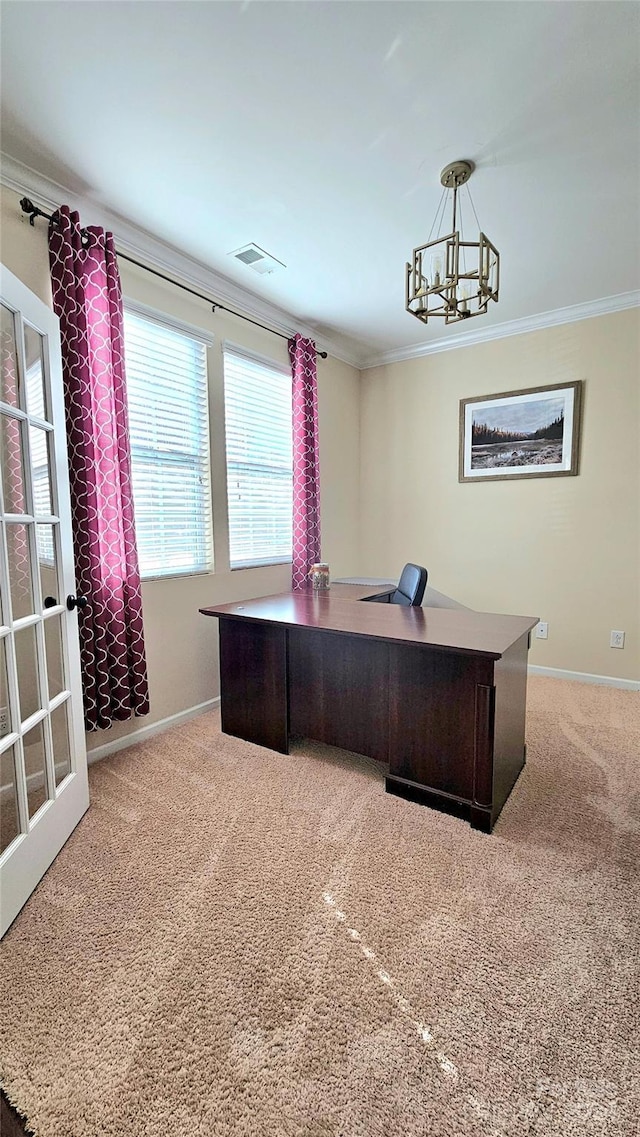 carpeted office with crown molding, a notable chandelier, baseboards, and visible vents