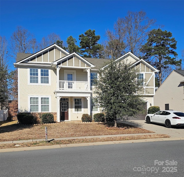 view of front of house with a balcony