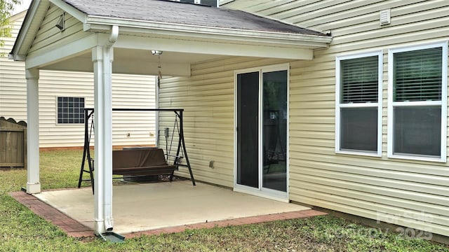 view of patio featuring fence