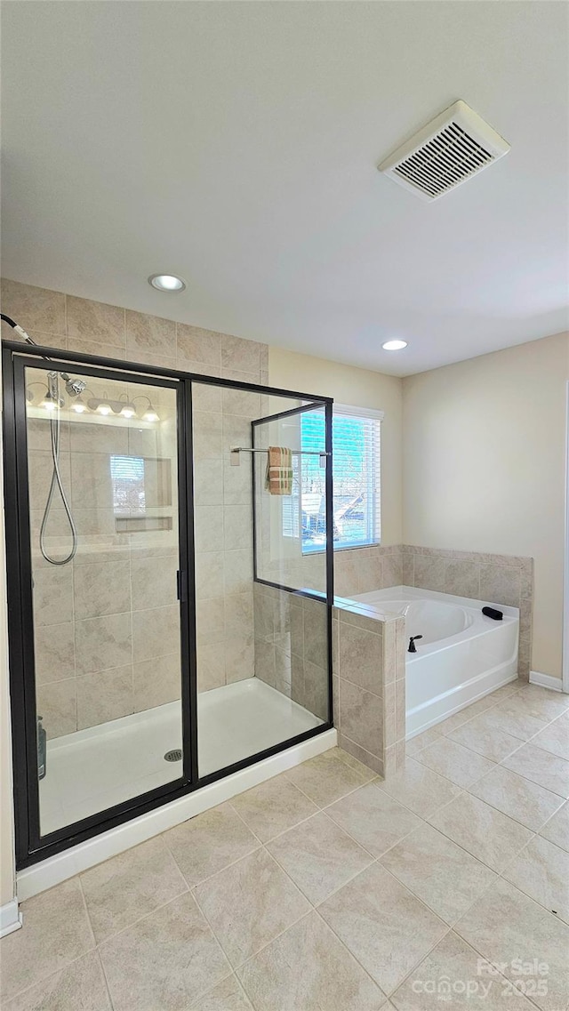 full bath featuring a shower stall, visible vents, and a garden tub