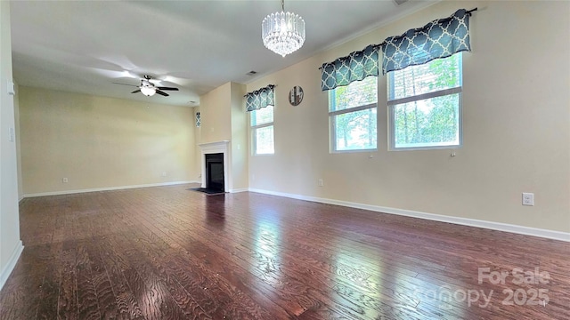 unfurnished living room featuring a fireplace with flush hearth, visible vents, baseboards, and hardwood / wood-style floors