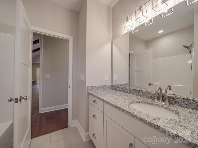 bathroom featuring hardwood / wood-style flooring and vanity