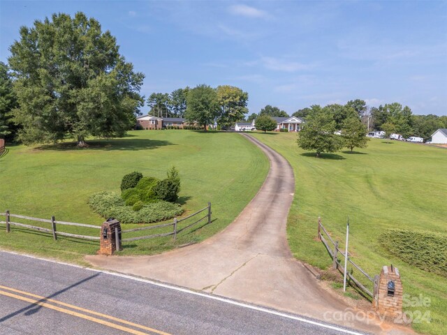 surrounding community featuring a lawn