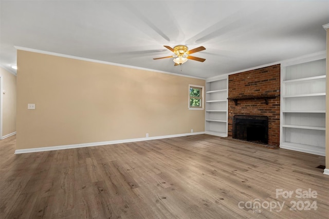 unfurnished living room featuring ceiling fan, a fireplace, and light hardwood / wood-style floors