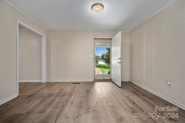 unfurnished room featuring hardwood / wood-style floors