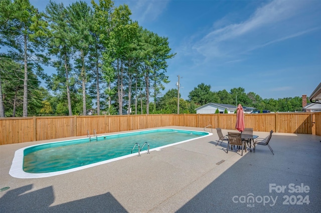 view of pool with a patio area