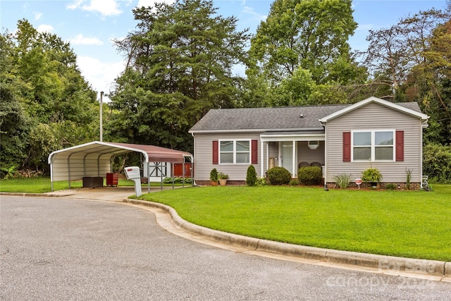 view of front of house featuring a front lawn and a carport