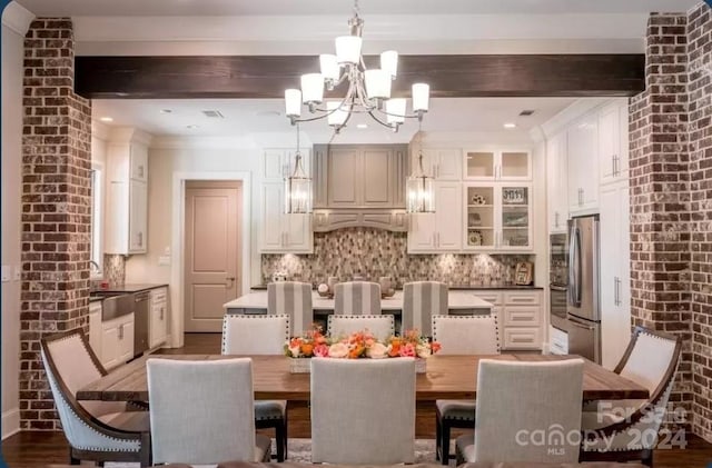 182 Shagbark Ct, Mount Gilead, NC 27306 - dining area featuring a chandelier, beamed ceiling, dark wood-type flooring, and brick wall
