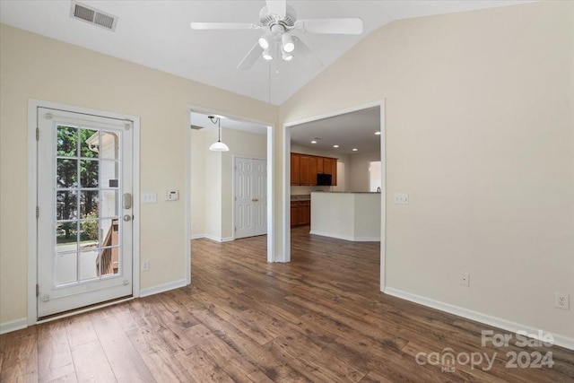 empty room featuring ceiling fan, lofted ceiling, and dark hardwood / wood-style flooring