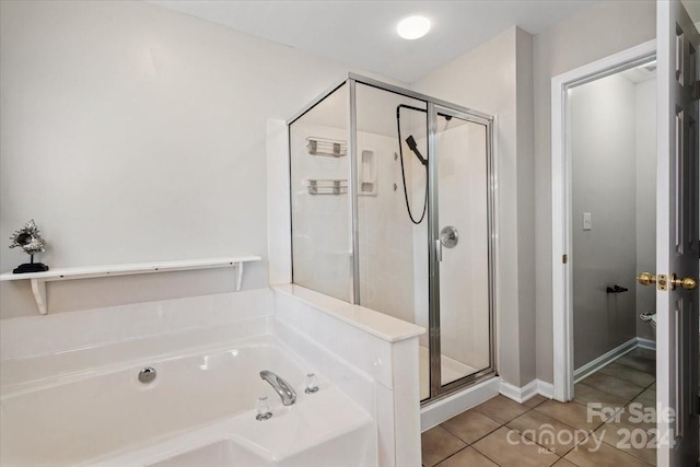 bathroom featuring tile patterned floors and plus walk in shower