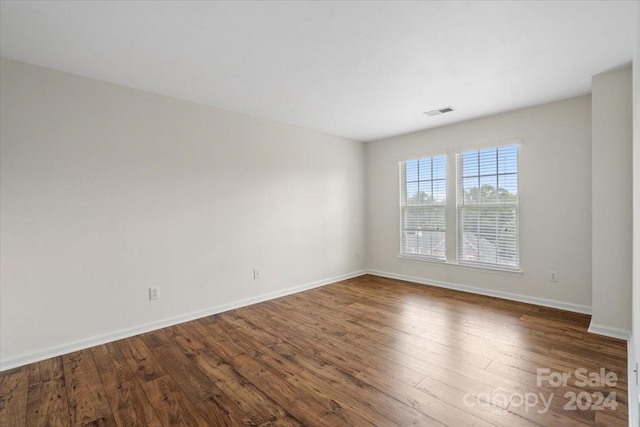 empty room featuring hardwood / wood-style flooring