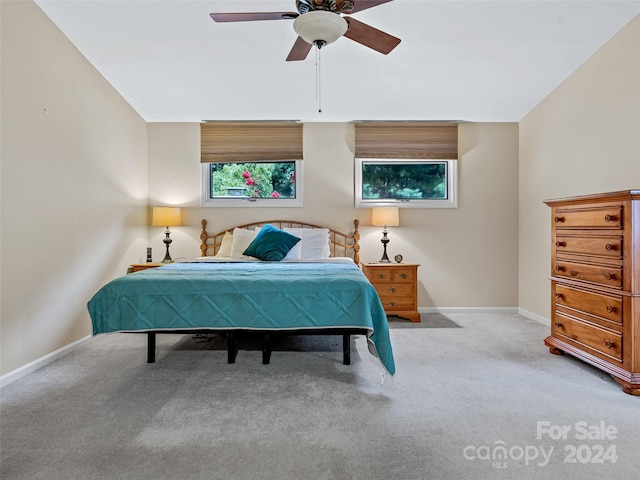 bedroom with carpet floors, ceiling fan, and baseboards