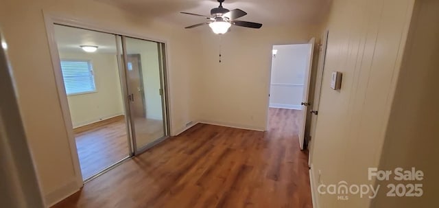 interior space with hardwood / wood-style flooring, a closet, and ceiling fan